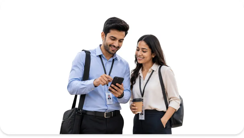 Two corporate employees checking their MoveInSync carpool ride on a smartphone